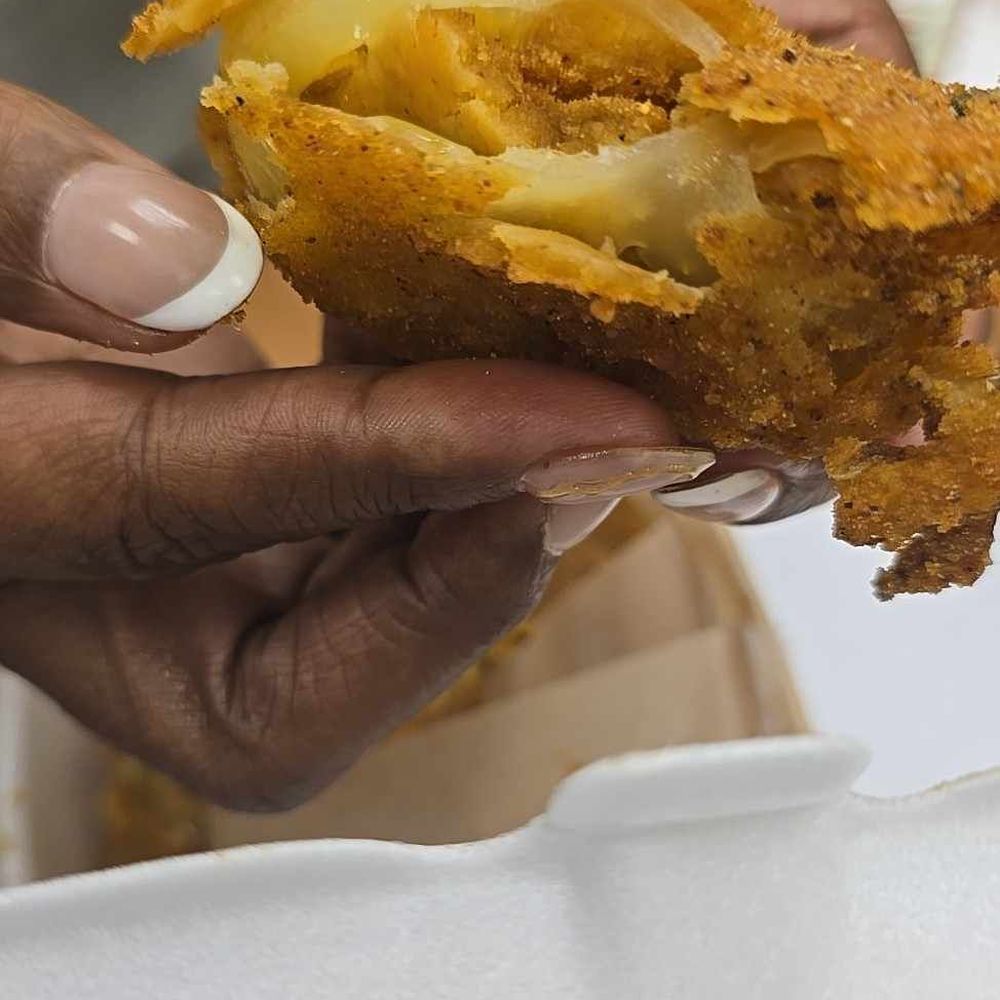Riko's Kickin' Chicken - Fried green tomato that was raw on the inside. - Chicken Wings Near Me - Memphis, Tennessee Riko's Kickin' Chicken - Fried green tomato that was raw on the inside. - Chicken Wings Near Me - Memphis, Tennessee
