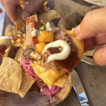 Huli Sue’s - One bite of brisket nachos - Hawaiian Near Me - Asheville, North Carolina Huli Sue’s - One bite of brisket nachos - Hawaiian Near Me - Asheville, North Carolina