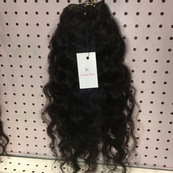 Limon Hair - Unprocessed natural curly sew in hair weaves available in 10" to 30" . Naturally healthy and bouncy hair .