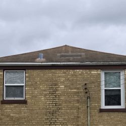 Roman Roofing - Before: back of house and bald spot