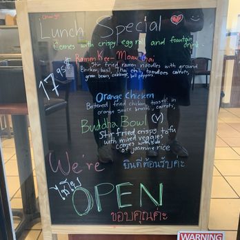 Chai Yo - Lunch special - A chalkboard sign outside a restaurant lists lunch specials including ramen, orange chicken, and Buddha bowl, with prices and descriptions. - Coffee & Tea Near Me - Santa Fe, New Mexico