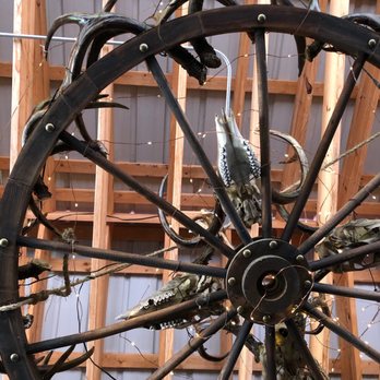 Jake's Place - Wooden wheel chandelier overhead. You can see the teeth in these animal skulls! - Southern Near Me - Ashland, Virginia Jake's Place - Wooden wheel chandelier overhead. You can see the teeth in these animal skulls! - Southern Near Me - Ashland, Virginia