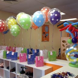 Gumball inside balloon with polka dots and whimsical swirls on top balloons at Gymboree Play Gym