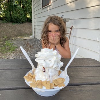 Shaffer's Frosty Freeze - a little girl sitting at a table with a bowl of ice cream and whipped cream - Ice Cream & Frozen Yogurt Near Me - Johnstown, Pennsylvania Shaffer's Frosty Freeze - a little girl sitting at a table with a bowl of ice cream and whipped cream - Ice Cream & Frozen Yogurt Near Me - Johnstown, Pennsylvania
