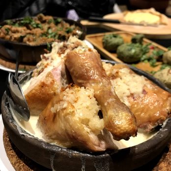 Chicago Diplomat Cafe - Chkmeruli ($14): Traditional Georgian style oven baked chicken soaked in garlic cream sauce served in a clay pan - Modern European Near Me - Chicago, Illinois