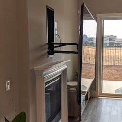 First Choice Custom Installations - Heavy Duty Recessed Mantel Mount with 100+ lb. 85" Sony Bravia TV on it  /  Lifting it is as easy as lifting a 15 lb. weight