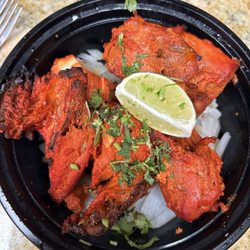 New Delhi Indian Restaurant - Chicken Tandoori - bit dry, but good herb and spice flavor.