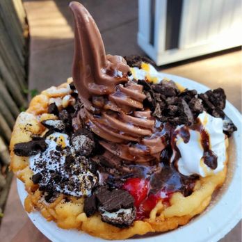 Six Flags Discovery Kingdom - Funnel cake supreme with chocolate ice cream, strawberry, oreos, caramel sauce, whipped cream, chocolate syrup and powdered sugar - Amusement Parks Near Me - Vallejo, California