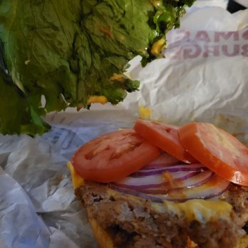 Smashburger - A single turkey burger up & close without top bun and lettuce. - Burgers Near Me - Valley Center, California Smashburger - A single turkey burger up & close without top bun and lettuce. - Burgers Near Me - Valley Center, California