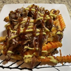 Sofrito Tan Rico - Pork shoulder (Pernil) on seasoned fries