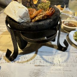 MOLCAJETE MIXTO Beef, chicken & shrimp with grilled cheese & veggies & salsa tatemada