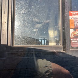 the reflection of a person in a window