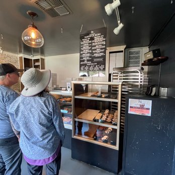 Pushkin's Bakery - a man and a woman standing in front of a counter - Bakeries Near Me - Sacramento, California Pushkin's Bakery - a man and a woman standing in front of a counter - Bakeries Near Me - Sacramento, California