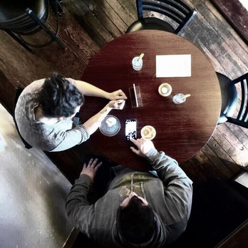 W Wallace - Us at a table below a mirror - Bars Near Me - Salem, Oregon