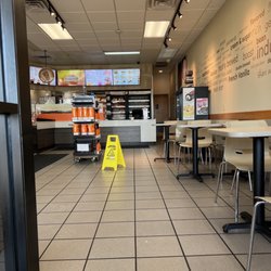Dunkin' - Front of restaurant--sticky floor despite "wet floor" sign.