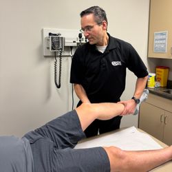 Grand River Sports Medicine - Dr. Hall, GRSM Sports Medicine Doctor assessing patient