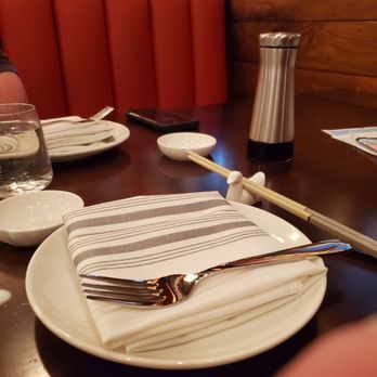 Karma Burlington - Nice place setting with cloth napkins and chopsticks on a ceramic bird holder. - Asian Fusion Near Me - Burlington, Massachusetts Karma Burlington - Nice place setting with cloth napkins and chopsticks on a ceramic bird holder. - Asian Fusion Near Me - Burlington, Massachusetts