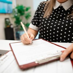 Lone Star Chiro - Patient filling out paperwork