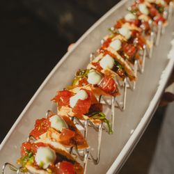 Trumpet Vine Catering - Tuna Poke Tacos: Wasabi mayo, black sesame, scallions, & crispy won ton shells