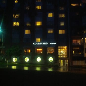 Courtyard by Marriott Burlington Harbor - Hotel from across the street, at night, in the rain. - Hotels Near Me - Burlington, Vermont
