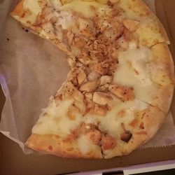 Emilio's Brick Oven Gourmet Pizza - Chicken dumped on the pizza