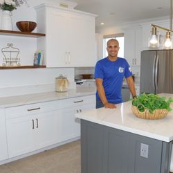 Island Contractors - Our Project Manager Marllon checking out the kitchen he remodeled for a happy client.
