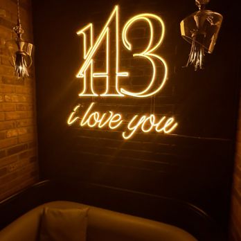 143 Social - a couch in a dimly lit room - Cocktail Bars Near Me - Jersey City, New Jersey