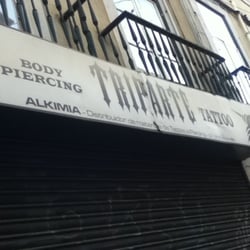 Triparte Body Piercing Tattoo