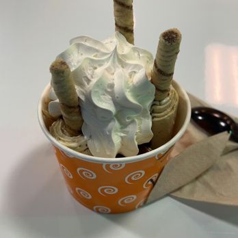 Curly Cream Rolled Ice Cream - Vanilla with coffee mix in and topped with whipped cream, hazelnut sticks, and Nutella - Ice Cream & Frozen Yogurt Near Me - Destin, Florida Curly Cream Rolled Ice Cream - Vanilla with coffee mix in and topped with whipped cream, hazelnut sticks, and Nutella - Ice Cream & Frozen Yogurt Near Me - Destin, Florida