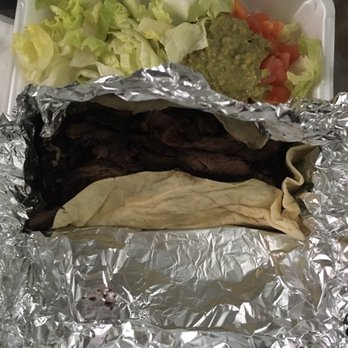 Top Taco - a sandwich wrapped in aluminum foil with lettuce, tomatoes, and guacamole - Mexican Near Me - Brooklyn, New York