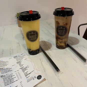 Milk Cha-Cha - Left: Mango Yakult with Boba. Right: Chocolate milk tea with custard and milkie popping boba. - Bubble Tea Near Me - Charlotte, North Carolina Milk Cha-Cha - Left: Mango Yakult with Boba. Right: Chocolate milk tea with custard and milkie popping boba. - Bubble Tea Near Me - Charlotte, North Carolina