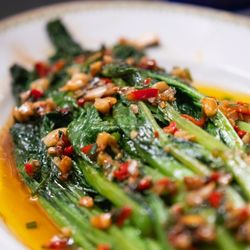 Where to Eat California - Gai Lan sauté in brown butter sauce, ShaoShing wine, Mirin, roasted garlic, and fried Ginger.