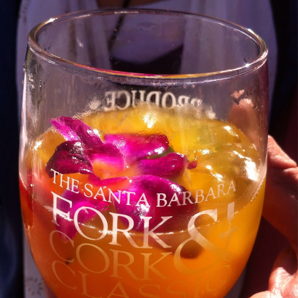 Fork and Cork - A passionfruit mojito from the VIP Lounge. With orchid garnish for extra posh;) - Festivals Near Me - Santa Barbara, California Fork and Cork - A passionfruit mojito from the VIP Lounge. With orchid garnish for extra posh;) - Festivals Near Me - Santa Barbara, California