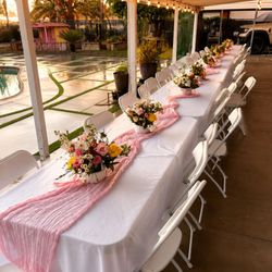 A & A Events And Photobooth - Elegant backyard dinner setup with blush runners, florals, and luxury seating for private celebrations.