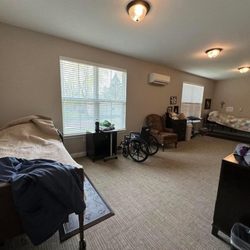 Grand Brook Memory Care - Zionsville - Shared bedroom. It was very large. My aunts lazy boy had a shelf fit full of photos.