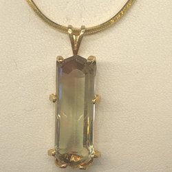 Goldsmiths Diamonds & Design - Large Trichroic Green sunstone cut by us with matching custom made pendant.