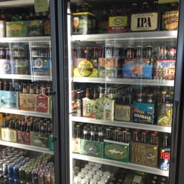 Fun beer selection, labeled by freezer with sticky notes (IPAs, Belgian, etc)