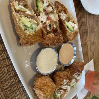 California Pizza Kitchen - a plate of food with dipping sauces - Pizza Near Me - Northwest, Alberta