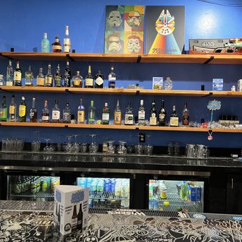 Coffee N' Comics -  bar with shelves of liquor - Coffee & Tea Near Me - Sparks, Nevada