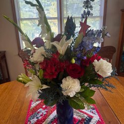 Flowerama - Cobalt blue vase with patriotic theme. Thanks to our men & women who served . Thanks to Flowerama for a beautiful arrangement.