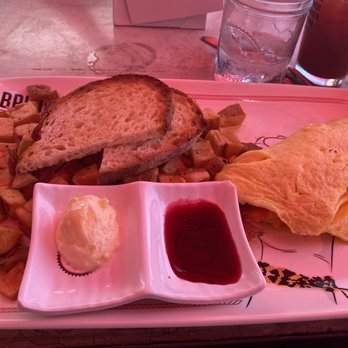 Breakfast Republic - Omelette with a side of sourdough bread and breakfast potatoes. - Breakfast & Brunch Near Me - San Diego, California Breakfast Republic - Omelette with a side of sourdough bread and breakfast potatoes. - Breakfast & Brunch Near Me - San Diego, California