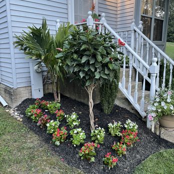 Todd Alexander’s Outdoor Services - a flower bed in front of a house - Lawn Services Near Me Todd Alexander’s Outdoor Services - a flower bed in front of a house - Lawn Services Near Me