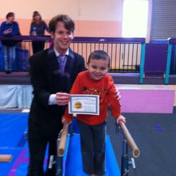 Rohnert Park Gymnastics - Eden with his first coach Trevor at "little champions"