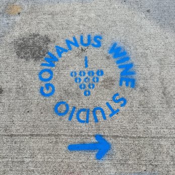 Gowanus Wine Studio & Tasting Table - a blue arrow on a sidewalk - Beer, Wine & Spirits Near Me - Brooklyn, New York Gowanus Wine Studio & Tasting Table - a blue arrow on a sidewalk - Beer, Wine & Spirits Near Me - Brooklyn, New York