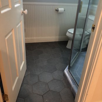 Styles In Tile - a bathroom with a shower and toilet - Flooring Near Me Styles In Tile - a bathroom with a shower and toilet - Flooring Near Me