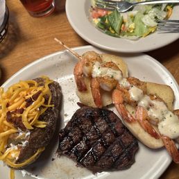 Sirloin* & Grilled Shrimp House Salad Baked Potato Also tried the Rattlesnake Bites and the rolls and everything was delicious! Sirloin* & Grilled Shrimp House Salad Baked Potato Also tried the Rattlesnake Bites and the rolls and everything was delicious!