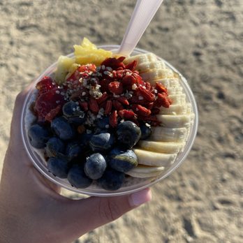 Just Bee Acai - a person holding a bowl of fruit - Food Trucks Near Me