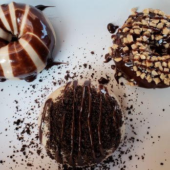 Duck Donuts - (Clockwise from top left)Peanut Butter Paradise, Chocolate w/Toffee Crunch & Hot Fudge drizzle, Peanut Butter w/Oreos and Hot Fudge drizzle. - Donuts Near Me - Hauppauge, New York Duck Donuts - (Clockwise from top left)Peanut Butter Paradise, Chocolate w/Toffee Crunch & Hot Fudge drizzle, Peanut Butter w/Oreos and Hot Fudge drizzle. - Donuts Near Me - Hauppauge, New York