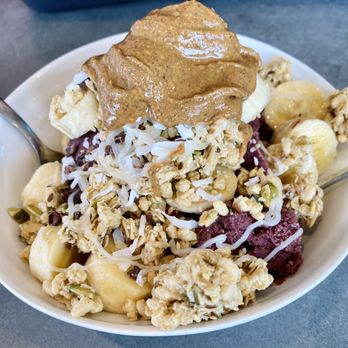 Vibe Cafe - Açaí bowl with granola, bananas, coconut, condensed milk, and almond butter. - Cafes Near Me - Hilo, Hawaii