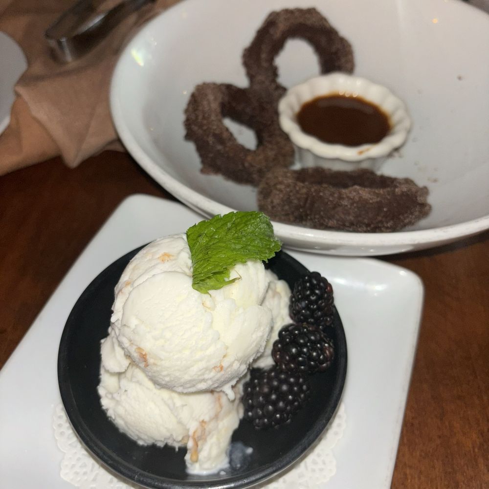 Gabbi's Mexican Kitchen - Warm cajeta with freshly made Churros topped with vanilla bean coconut ice cream the texture was amazing - Mexican Near Me - Orange, California Gabbi's Mexican Kitchen - Warm cajeta with freshly made Churros topped with vanilla bean coconut ice cream the texture was amazing - Mexican Near Me - Orange, California